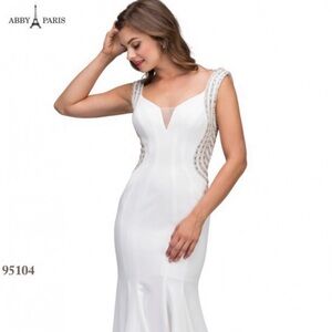 Red dress with silver beading on straps, side and back.